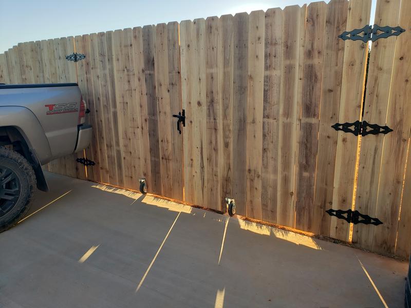 Privacy fence with rubber casters to move open
